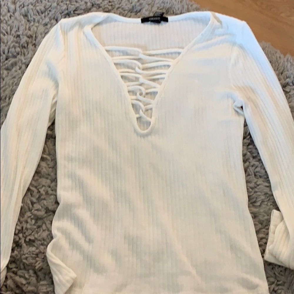 White ribbed sweater deep cut